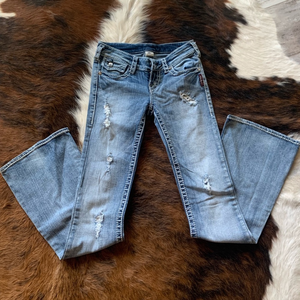 Silver destructed flare jeans size 24